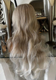 Christina - blonde on blonde platinum bodywave centre part